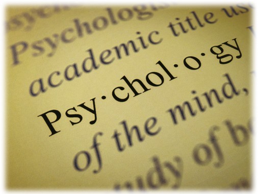 Psychology dictionary definition text with meaning printed on paper