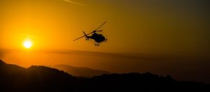 Helicopter hovering at sunset to suggest helicopter parenting style