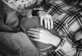 Illness or pain in stomach depicting physical health and mental health parity of esteem